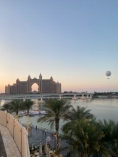 view of resort across waterway at dusk