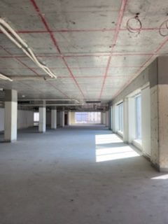 concrete walls and floors of empty commercial building under-construction