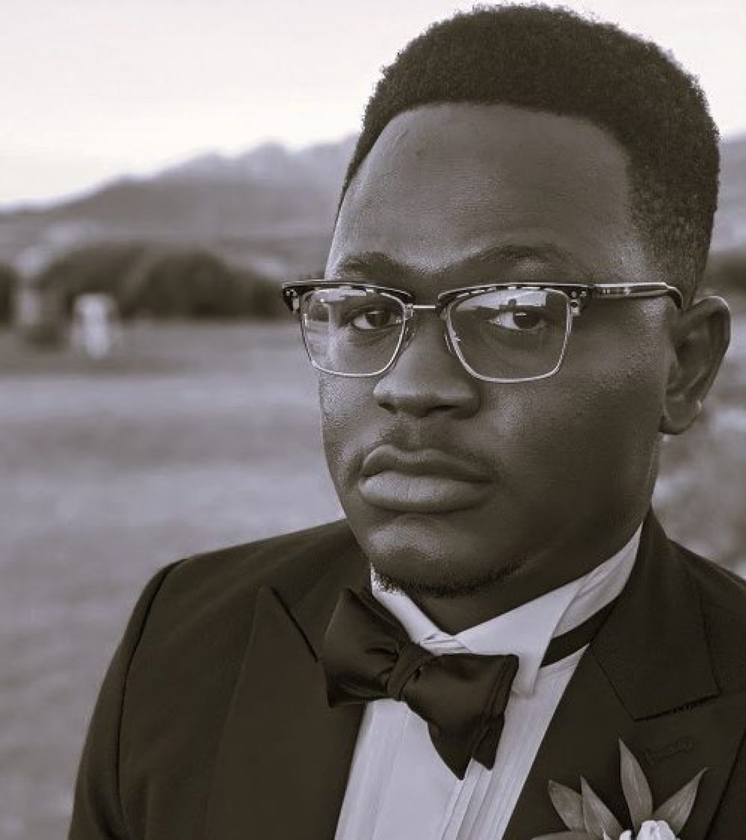 black and white portrait of Kayode Agbalajobi in tuxedo