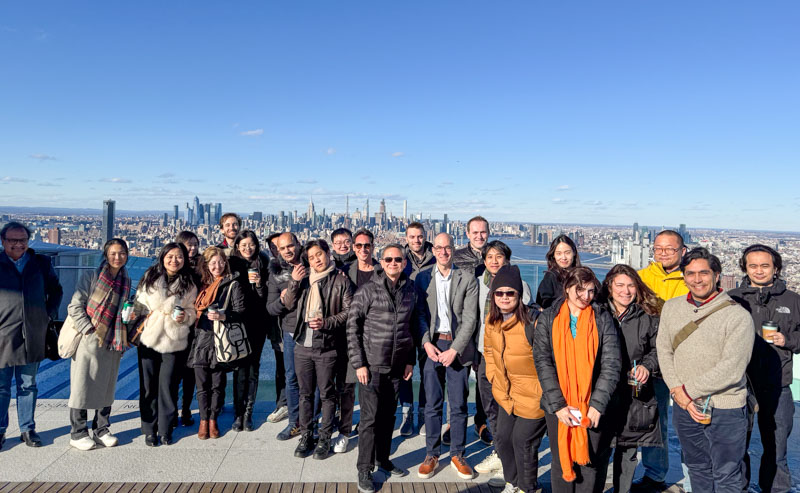 msred class photo on top of skyscraper overlooking New York City